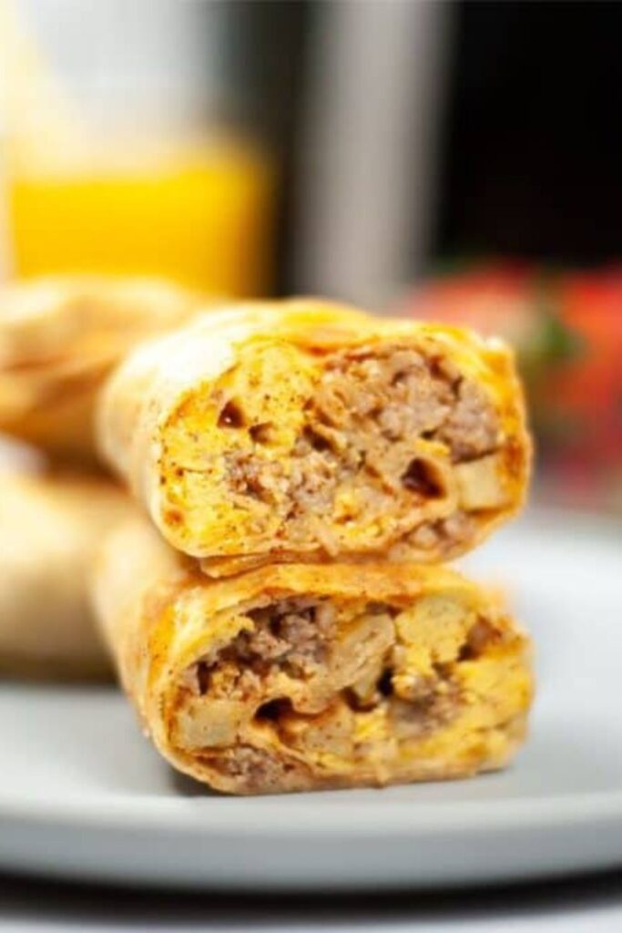 Breakfast Chimichanga cut in half and placed on a plate