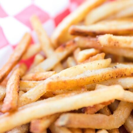 fries in a basket on table