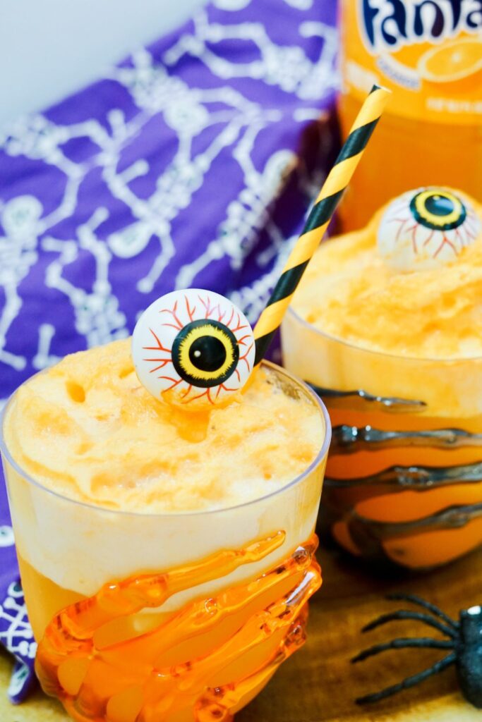 sherbet floats in glasses sitting on table with blue napkin behind it